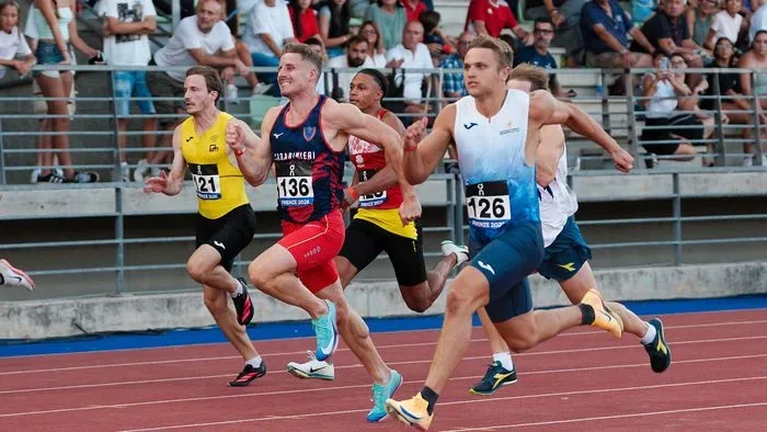 Marek sets the record in the 100, his the provincial record